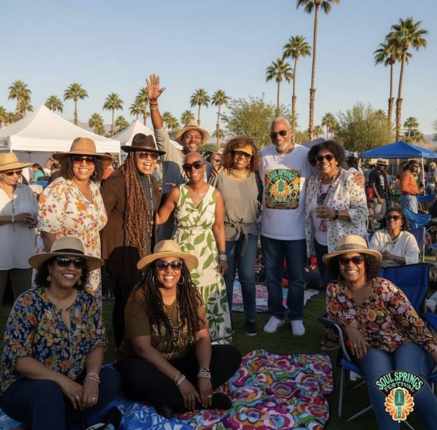 A crowd of guests in hats and sunglasses